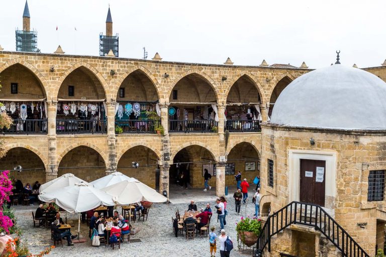Courtyard Büyük Han, Great Inn, the largest caravanserai in Cyprus. Built by order of the first ruler of the Ottomans in Cyprus, Muzaffer Pasha, in 1572. In the courtyard there is a small mosque with a domed roof and a fountain for ablutions before prayer. The building is considered one of the most beautiful buildings in Cyprus and is located in the northern Cypriot part of the divided city of Nicosia / © Photo: Georg Berg