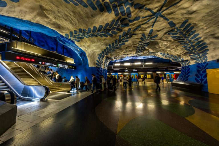 Subway art in Stockholm, T-Centralen metro station at Stockholm Central Station and hub of the metro network was designed by artist Per Olof Ultvedt in blue colors and with simple motifs such as stylized flowers and leafy vines. The shapes and colors are intended to have a calming effect on passengers. One of a total of 38 grotto stations / © Photo: Georg Berg